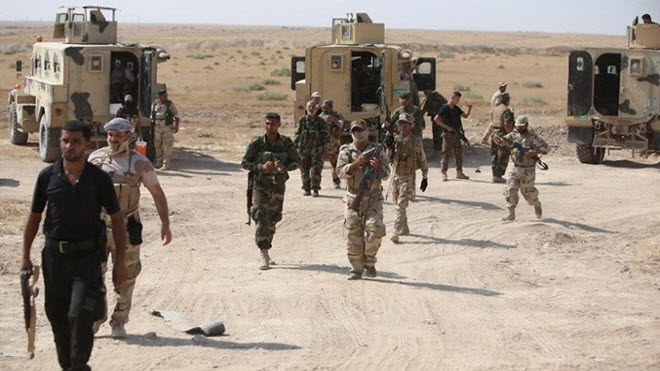 مجموعة من القوات الأمن العراقية بعد قتال عناصر داعش شمال العراق - AFP
